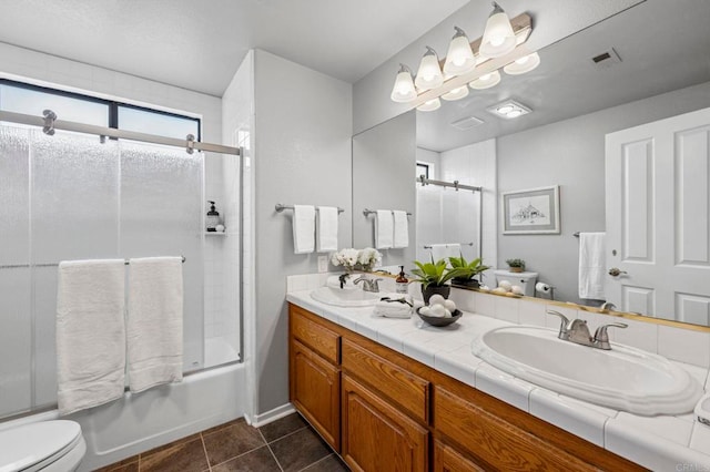 3048 Jason Rd, Fallbrook, CA 92028 - full bathroom featuring double vanity, shower / bath combination with glass door, and tile patterned floors