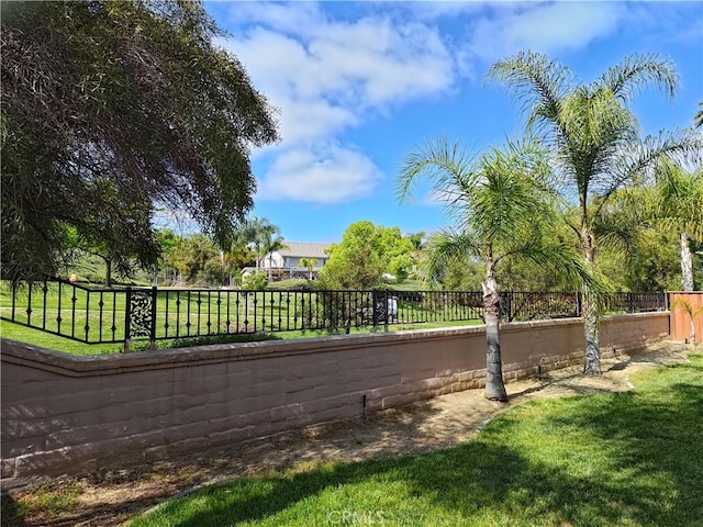 exterior space featuring a fenced backyard and a yard
