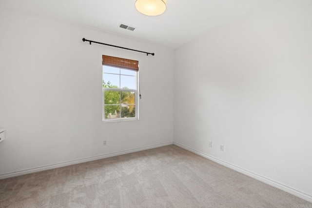 2705 Plumeria Dr, Carlsbad, CA 92009 - empty room with light colored carpet, visible vents, and baseboards