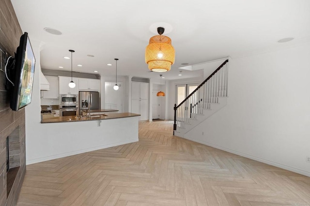 2705 Plumeria Dr, Carlsbad, CA 92009 - unfurnished living room featuring stairs, baseboards, and recessed lighting