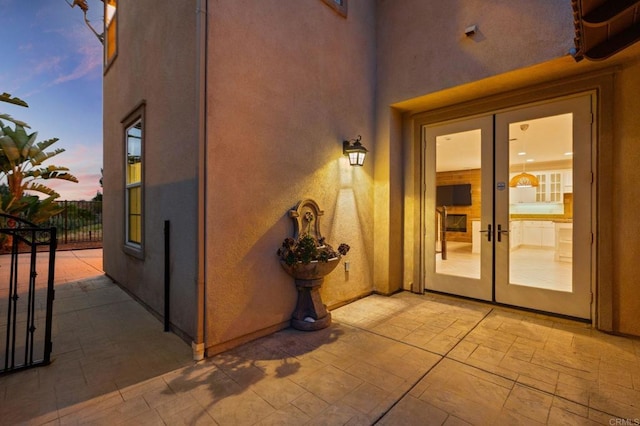 2705 Plumeria Dr, Carlsbad, CA 92009 - doorway to property with a patio, stucco siding, and french doors