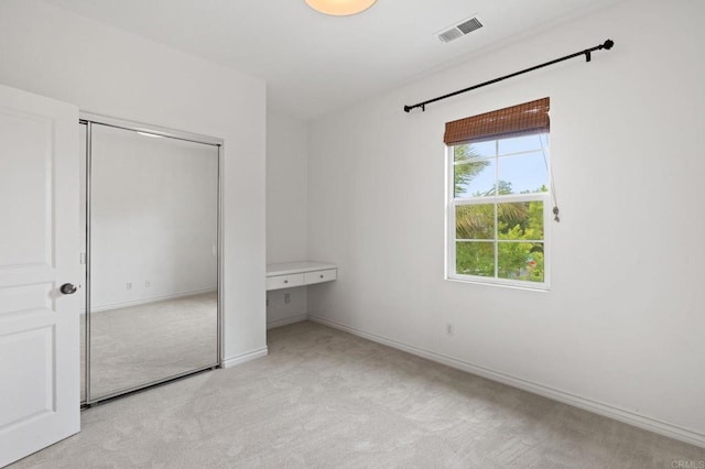 2705 Plumeria Dr, Carlsbad, CA 92009 - unfurnished bedroom featuring light carpet, a closet, baseboards, and visible vents