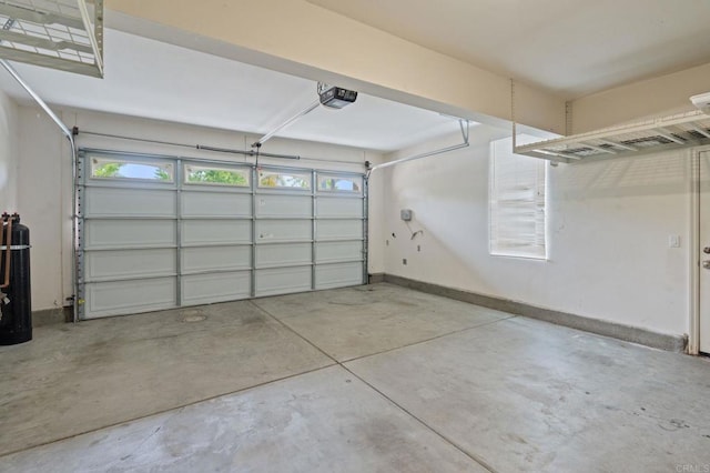 2705 Plumeria Dr, Carlsbad, CA 92009 - garage with baseboards and a garage door opener