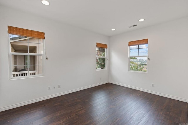 2705 Plumeria Dr, Carlsbad, CA 92009 - spare room featuring visible vents, wood finished floors, baseboards, and recessed lighting
