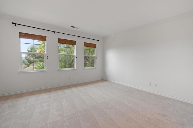 2705 Plumeria Dr, Carlsbad, CA 92009 - spare room featuring light carpet, ornamental molding, and visible vents