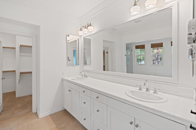 2705 Plumeria Dr, Carlsbad, CA 92009 - full bathroom with ornamental molding, a spacious closet, a sink, and double vanity