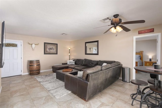 150020 Bluewater Rd, Big River, CA 92242 - living room with visible vents, baseboards, and a ceiling fan