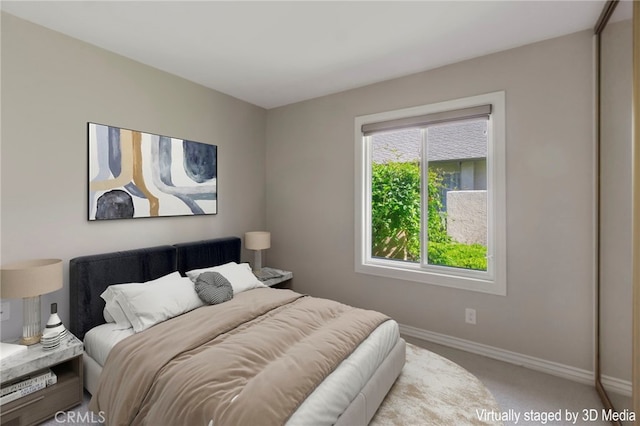 bedroom featuring carpet flooring and baseboards