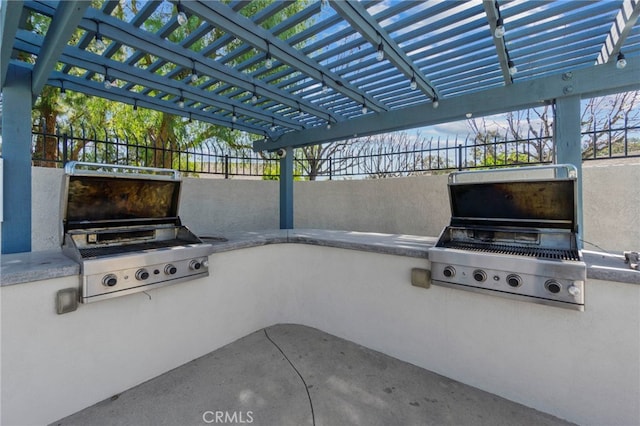 view of patio with area for grilling and exterior kitchen