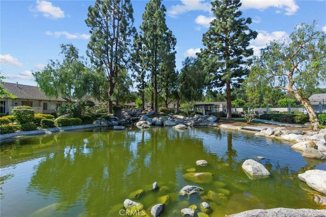 property view of water featuring a garden pond