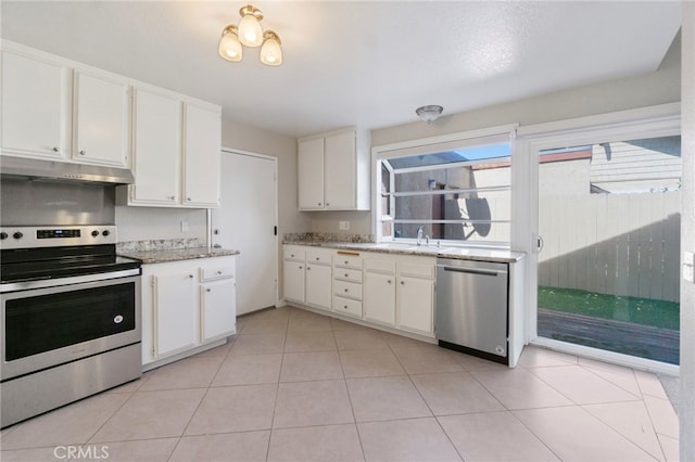 kitchen with white cabinetry, appliances with stainless steel finishes, and under cabinet range hood