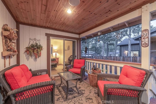 view of patio with outdoor lounge area and fence