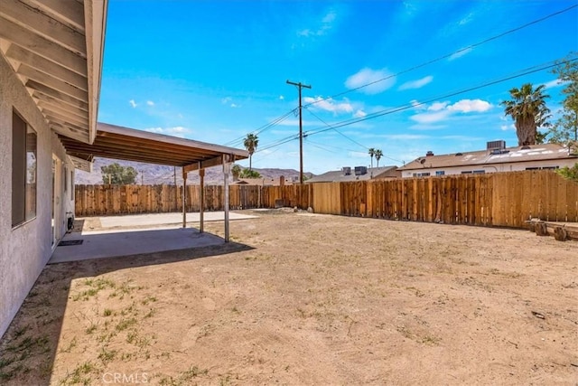 view of yard featuring a patio and a fenced backyard
