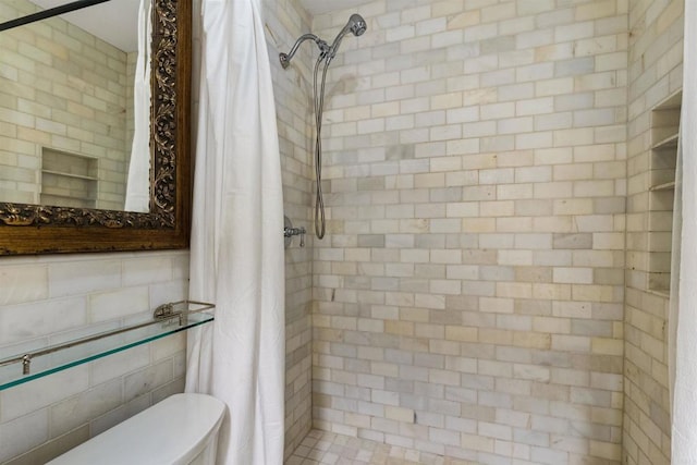 3527 Caminito Sierra Unit 202, Carlsbad, CA 92009 - bathroom featuring a tile shower and toilet
