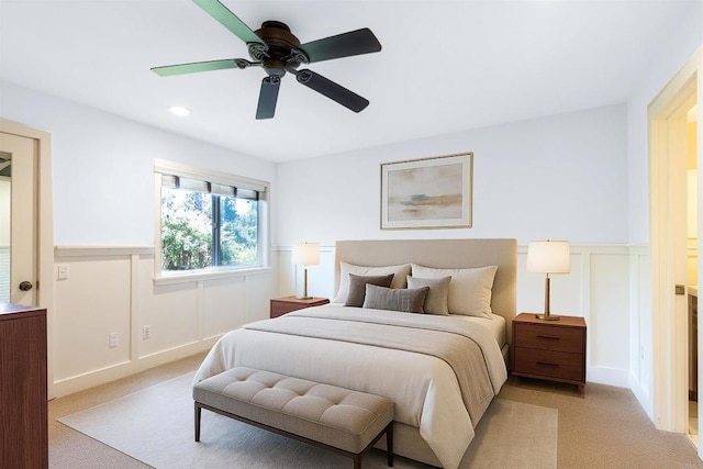 3527 Caminito Sierra Unit 202, Carlsbad, CA 92009 - bedroom featuring a wainscoted wall, light colored carpet, ceiling fan, a decorative wall, and recessed lighting