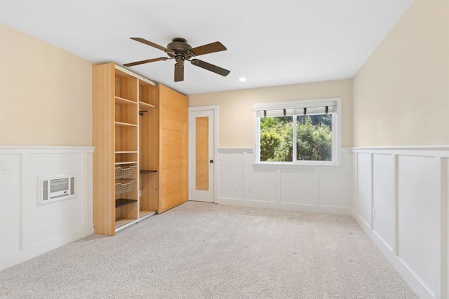 3527 Caminito Sierra Unit 202, Carlsbad, CA 92009 - unfurnished bedroom with light carpet, wainscoting, a decorative wall, a ceiling fan, and recessed lighting