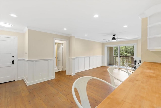 3527 Caminito Sierra Unit 202, Carlsbad, CA 92009 - dining space featuring hardwood / wood-style flooring, a ceiling fan, ornamental molding, recessed lighting, and a wainscoted wall