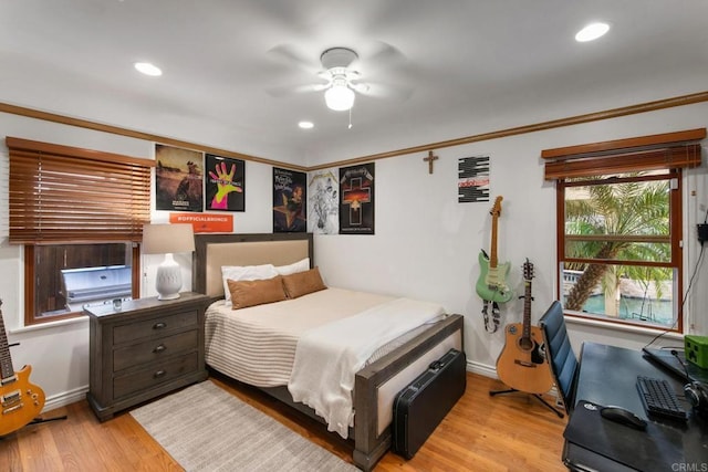 bedroom featuring light wood finished floors, baseboards, and recessed lighting