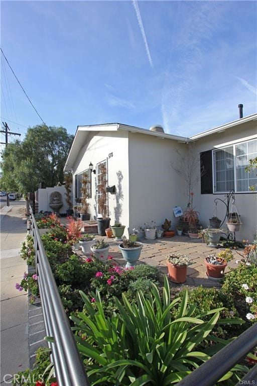 view of property exterior with a patio area and stucco siding