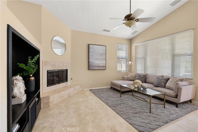 40050 Corte Fortuna, Murrieta, CA 92562 - living room with vaulted ceiling, visible vents, ceiling fan, and a tile fireplace