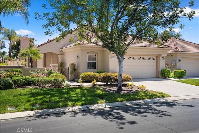 40050 Corte Fortuna, Murrieta, CA 92562 - mediterranean / spanish-style house featuring an attached garage, a tiled roof, stucco siding, a chimney, and driveway