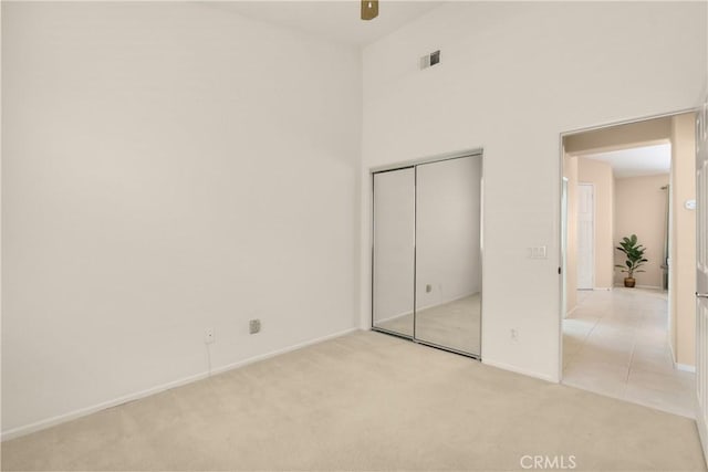 40050 Corte Fortuna, Murrieta, CA 92562 - unfurnished bedroom featuring a ceiling fan, a closet, baseboards, visible vents, and light carpet