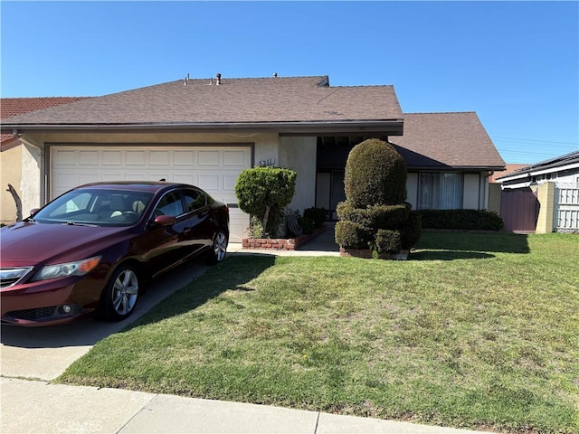 single story home featuring an attached garage, stucco siding, a shingled roof, a front lawn, and driveway