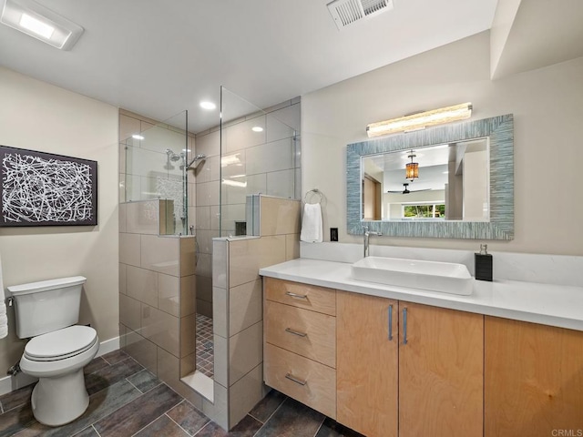 full bathroom with recessed lighting, toilet, walk in shower, visible vents, and vanity