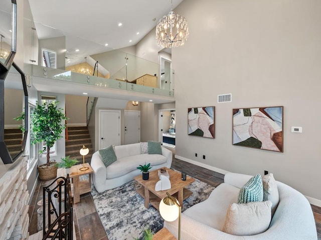 living room featuring recessed lighting, visible vents, baseboards, and stairs
