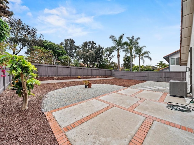view of patio / terrace with central AC unit and a fenced backyard