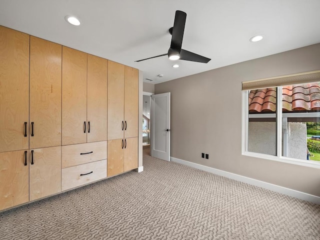 unfurnished bedroom with baseboards, recessed lighting, and carpet