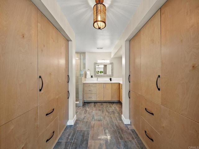 bathroom featuring vanity and visible vents