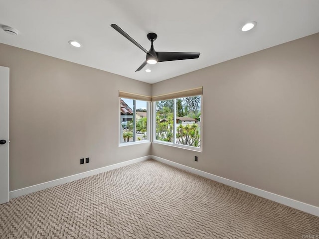 unfurnished room featuring a ceiling fan, light carpet, baseboards, and recessed lighting
