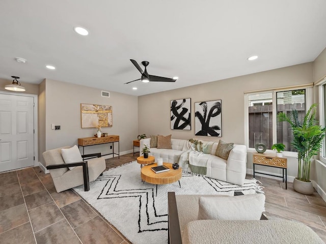 living room featuring visible vents, baseboards, ceiling fan, and recessed lighting