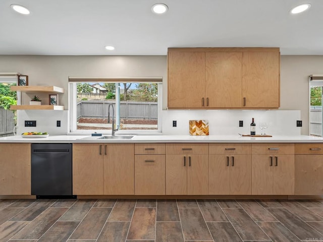 kitchen with light brown cabinetry, recessed lighting, dishwasher, a sink, and light countertops