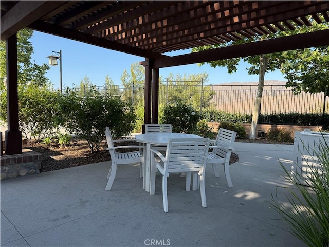 11151 Tesota Loop St, Corona, CA 92883 - view of patio featuring outdoor dining space and a pergola