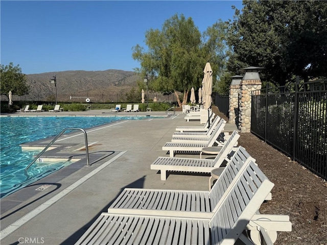 11151 Tesota Loop St, Corona, CA 92883 - community pool with a mountain view and a patio area
