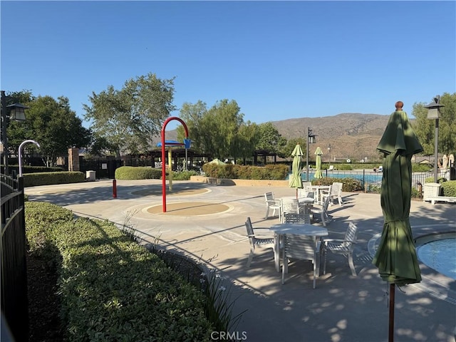 11151 Tesota Loop St, Corona, CA 92883 - surrounding community featuring a mountain view and a swimming pool