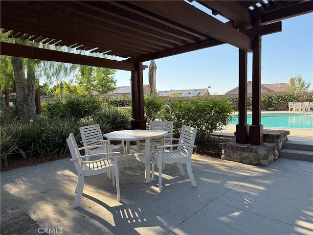 view of patio / terrace featuring a pergola and outdoor dining space