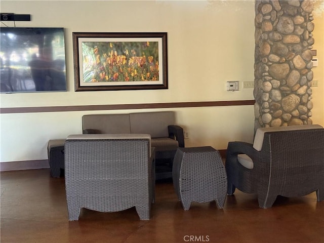 sitting room with concrete floors