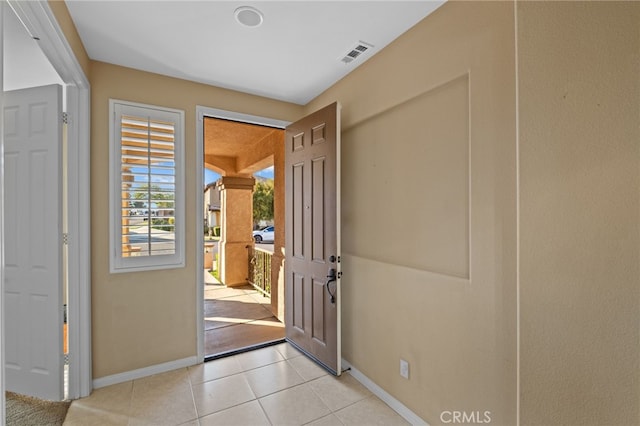11151 Tesota Loop St, Corona, CA 92883 - foyer with baseboards and light tile patterned flooring