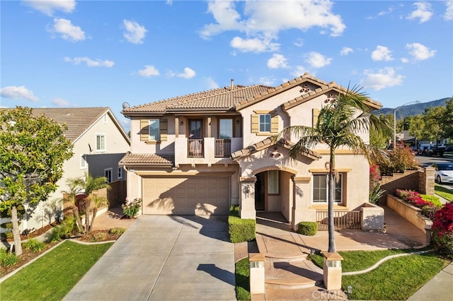 11151 Tesota Loop St, Corona, CA 92883 - mediterranean / spanish home with a balcony, an attached garage, stucco siding, driveway, and a tile roof
