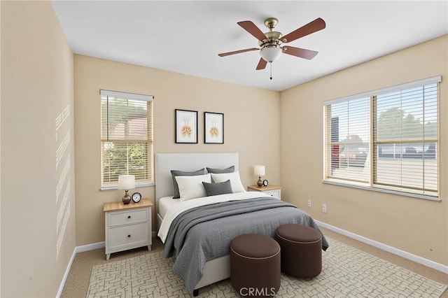 11151 Tesota Loop St, Corona, CA 92883 - bedroom featuring multiple windows, baseboards, and light carpet