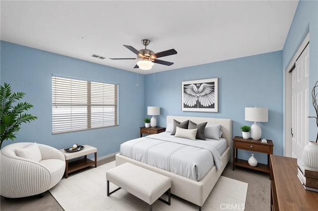 bedroom featuring carpet, a closet, ceiling fan, and baseboards