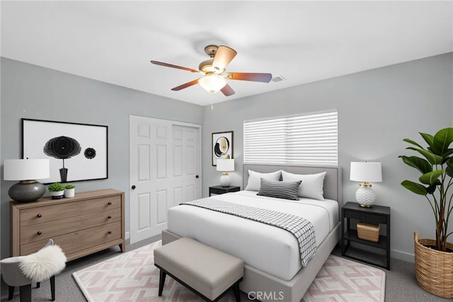 11151 Tesota Loop St, Corona, CA 92883 - carpeted bedroom featuring a closet, a ceiling fan, and baseboards