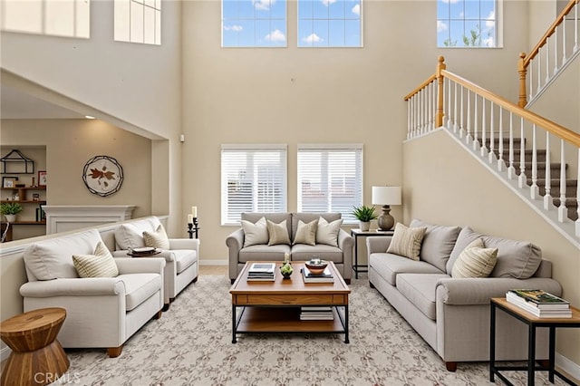 11151 Tesota Loop St, Corona, CA 92883 - living room with a high ceiling, stairway, and baseboards