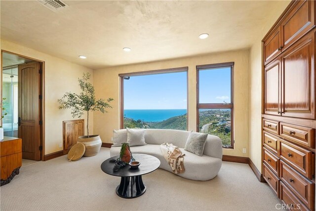 2516 Temple Hills Dr, Laguna Beach, CA 92651 - sitting room with light colored carpet, baseboards, recessed lighting, and a water view