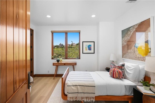 2516 Temple Hills Dr, Laguna Beach, CA 92651 - bedroom with light wood-style flooring, recessed lighting, and baseboards