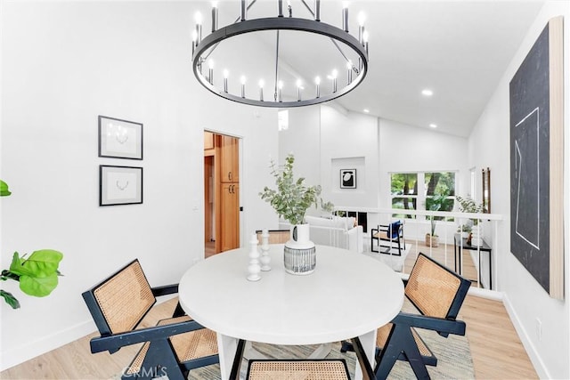 5431 Via Ontiveros, Yorba Linda, CA 92887 - dining area featuring an inviting chandelier, baseboards, high vaulted ceiling, and light wood-style floors