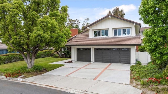 5431 Via Ontiveros, Yorba Linda, CA 92887 - view of front facade featuring fence, a tile roof, concrete driveway, a front lawn, and a chimney